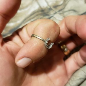 silver horseshoe stamped missing a stone